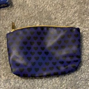 blue with black hearts make up bag